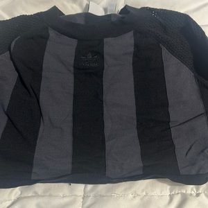 This is a cropped adidas fitted sportswear top. Looks great and very stretchy.